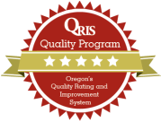 Red QRIS Quality Program seal with four white stars and a gold ribbon